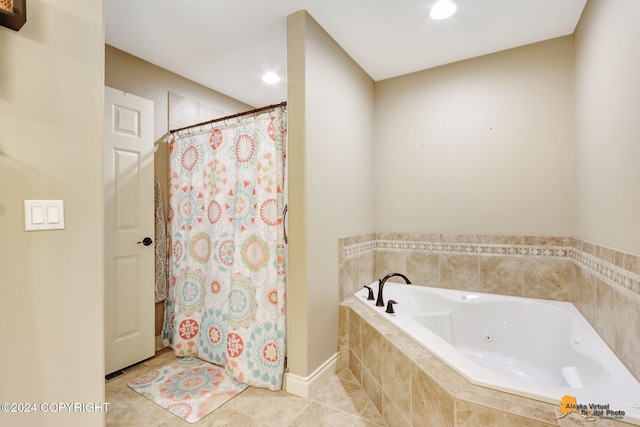 bathroom featuring tile patterned flooring and independent shower and bath