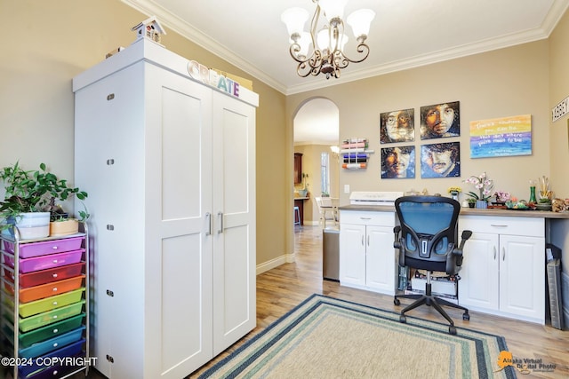 home office featuring a chandelier, built in desk, light hardwood / wood-style floors, and ornamental molding