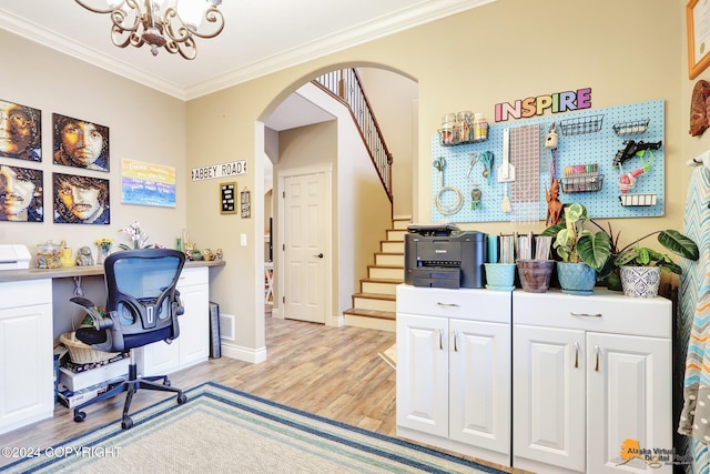 office space featuring a notable chandelier, light wood-type flooring, and ornamental molding