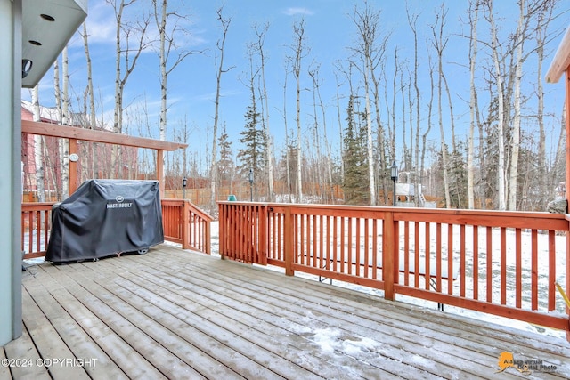 snow covered deck with grilling area