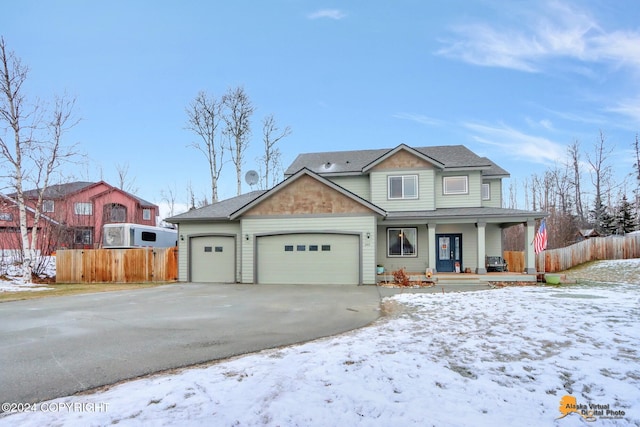 view of front of home featuring a porch and a garage