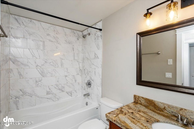 full bathroom with vanity, toilet, and tiled shower / bath combo