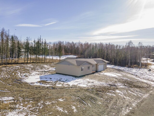 4980 Kelsi Loop, Wasilla, AK 99654 - snowy aerial view featuring a view of trees