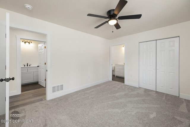 4980 Kelsi Loop, Wasilla, AK 99654 - unfurnished bedroom with carpet, visible vents, ensuite bathroom, and baseboards