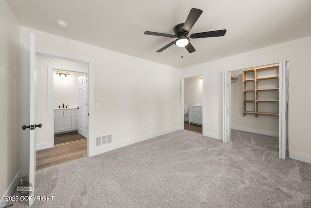 4980 Kelsi Loop, Wasilla, AK 99654 - unfurnished bedroom featuring carpet flooring, baseboards, visible vents, and connected bathroom