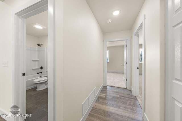 4980 Kelsi Loop, Wasilla, AK 99654 - hall featuring wood finished floors, baseboards, and visible vents
