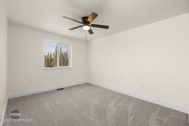 4980 Kelsi Loop, Wasilla, AK 99654 - carpeted spare room with visible vents, baseboards, and ceiling fan