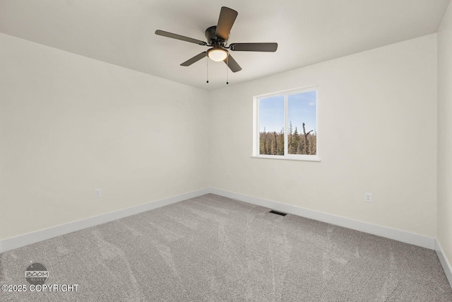 4980 Kelsi Loop, Wasilla, AK 99654 - carpeted spare room featuring a ceiling fan, baseboards, and visible vents
