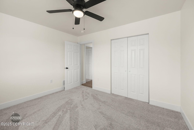 4980 Kelsi Loop, Wasilla, AK 99654 - unfurnished bedroom with baseboards, carpet floors, a closet, and ceiling fan