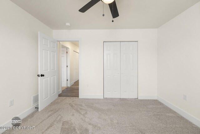 4980 Kelsi Loop, Wasilla, AK 99654 - unfurnished bedroom featuring a ceiling fan, baseboards, visible vents, carpet floors, and a closet