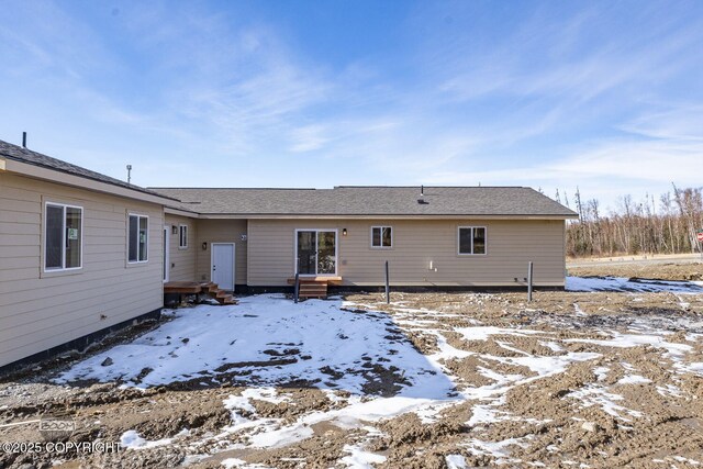 4980 Kelsi Loop, Wasilla, AK 99654 - snow covered rear of property featuring roof with shingles