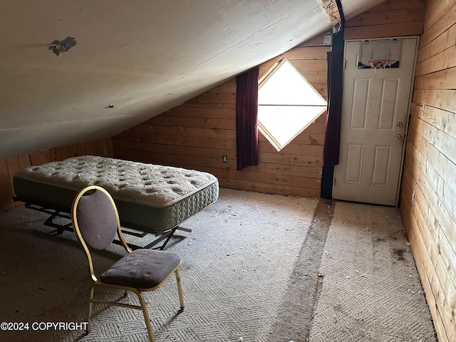 bonus room featuring carpet floors, vaulted ceiling, and wood walls