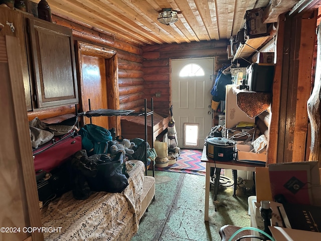 miscellaneous room with rustic walls, a wealth of natural light, and wood ceiling