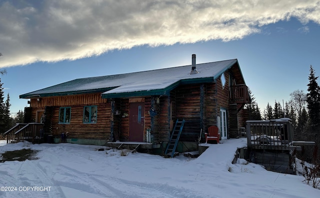 log home with a balcony