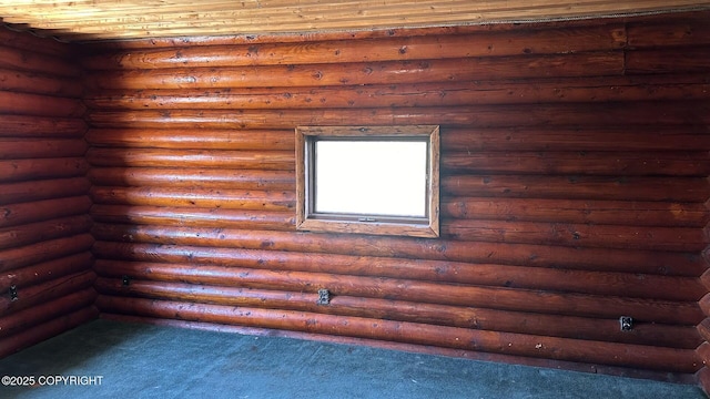 68537 Veater Ave, Ninilchik, AK 99639 - empty room featuring log walls and dark colored carpet