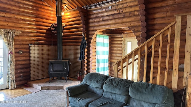 68537 Veater Ave, Ninilchik, AK 99639 - living room with a wood stove, log walls, and carpet