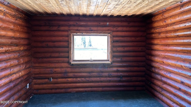 68537 Veater Ave, Ninilchik, AK 99639 - unfurnished room with wooden ceiling, dark carpet, and log walls