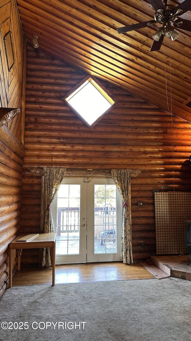 68537 Veater Ave, Ninilchik, AK 99639 - unfurnished living room with log walls, french doors, ceiling fan, and high vaulted ceiling