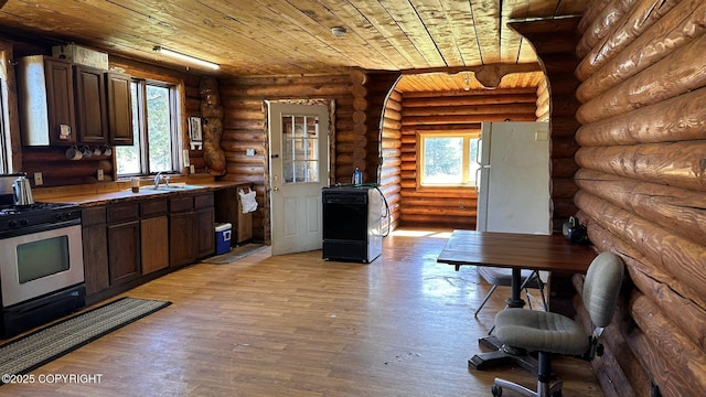 68537 Veater Ave, Ninilchik, AK 99639 - kitchen featuring stainless steel gas range, wood ceiling, healthy amount of natural light, a sink, and dark brown cabinetry