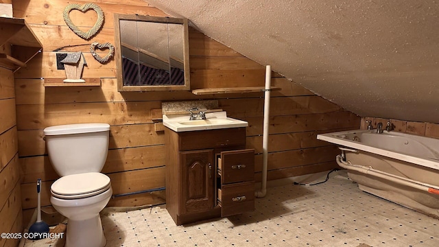 68537 Veater Ave, Ninilchik, AK 99639 - bathroom with tile patterned floors, wooden walls, toilet, vanity, and a bathtub