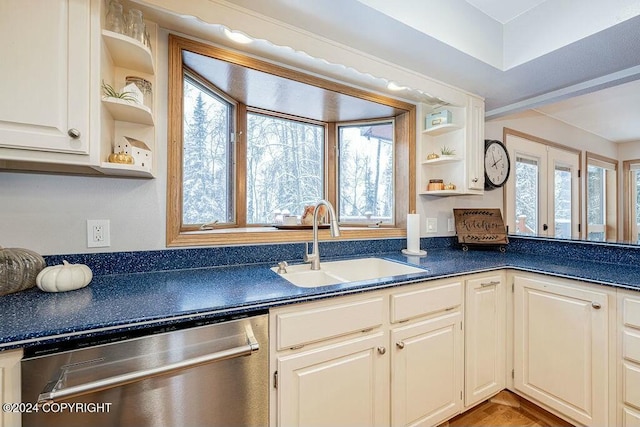 kitchen with dishwasher, a wealth of natural light, and sink