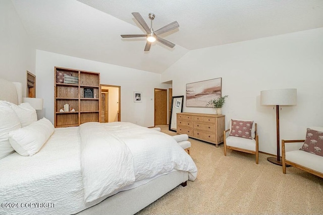 carpeted bedroom with ceiling fan and lofted ceiling