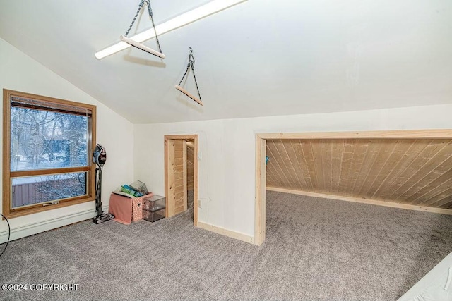 bonus room featuring carpet flooring and vaulted ceiling