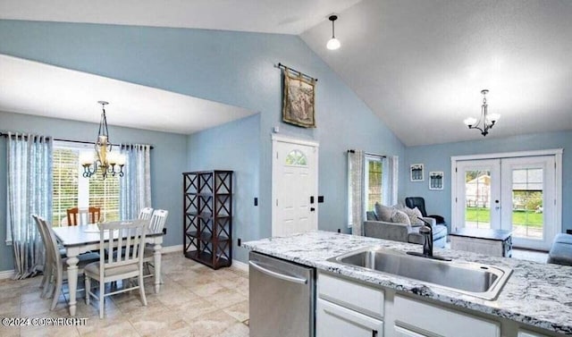 kitchen featuring dishwasher, french doors, white cabinets, vaulted ceiling, and decorative light fixtures