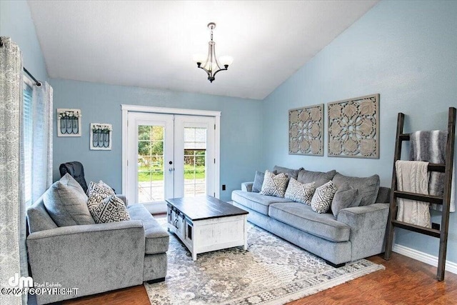 5169 Reliance Rd, Wasilla, AK 99654 - living area with lofted ceiling, french doors, wood finished floors, and a chandelier