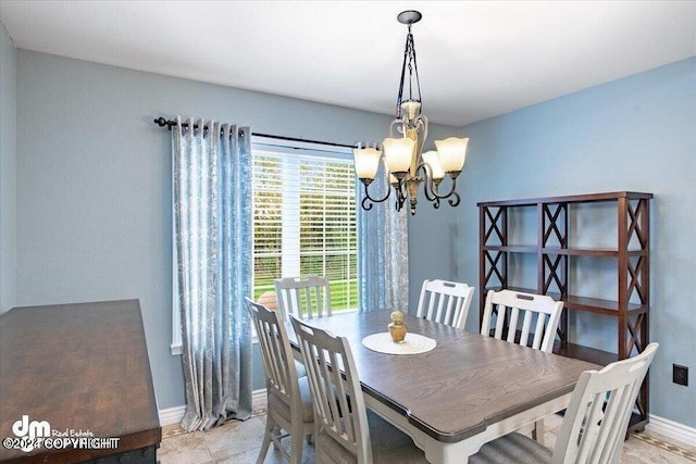 dining space featuring an inviting chandelier