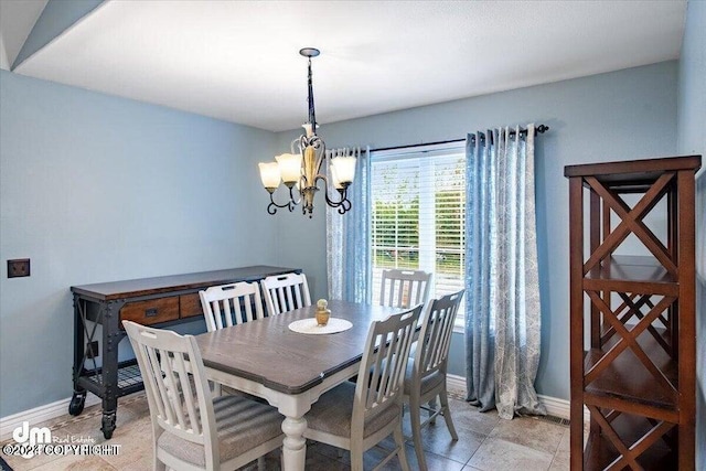 5169 Reliance Rd, Wasilla, AK 99654 - dining area featuring baseboards and a chandelier