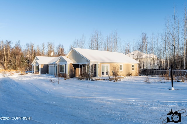 5169 Reliance Rd, Wasilla, AK 99654 - view of front of property featuring french doors, a garage, and board and batten siding