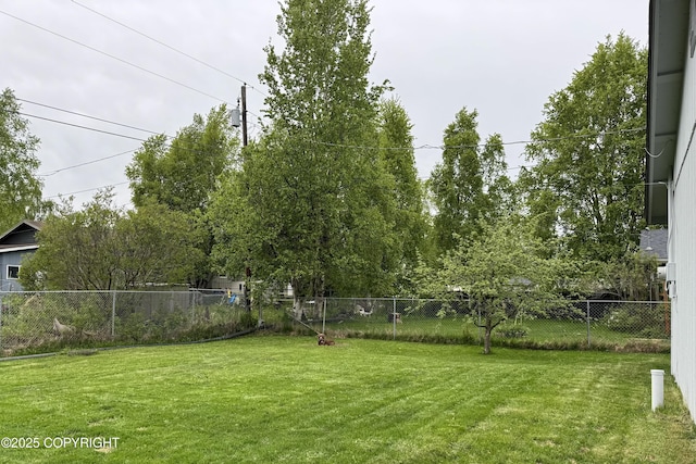 view of yard with a fenced backyard