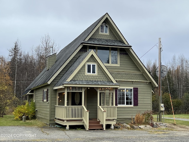 38400 Robinson Loop Rd, Sterling, AK 99672 - victorian home with a porch and a chimney