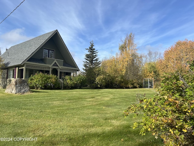 38400 Robinson Loop Rd, Sterling, AK 99672 - view of home's exterior with a lawn and a shingled roof