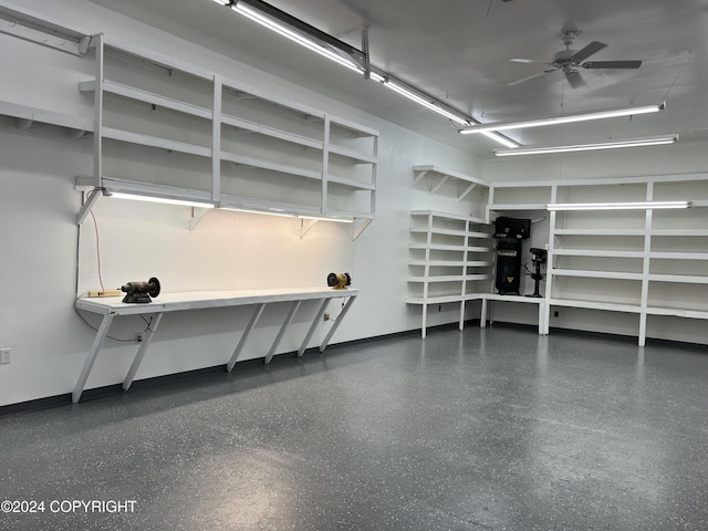 38400 Robinson Loop Rd, Sterling, AK 99672 - garage featuring baseboards and ceiling fan