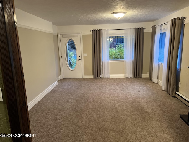 38400 Robinson Loop Rd, Sterling, AK 99672 - carpeted spare room featuring a textured ceiling and baseboards