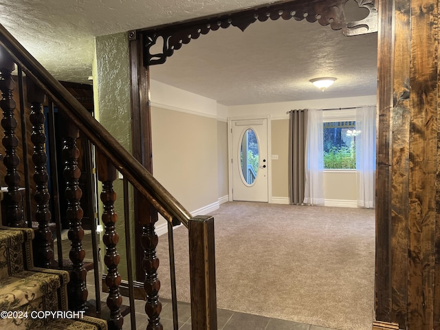 38400 Robinson Loop Rd, Sterling, AK 99672 - entryway with a textured ceiling, carpet, and baseboards