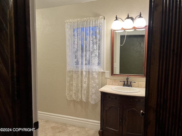 38400 Robinson Loop Rd, Sterling, AK 99672 - bathroom with vanity and baseboards