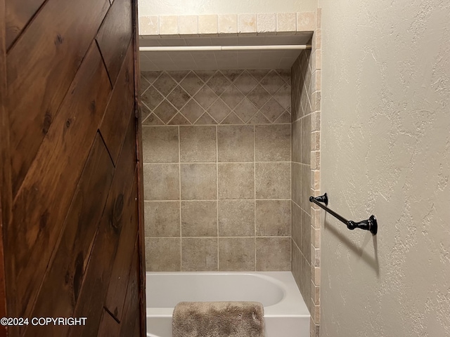 38400 Robinson Loop Rd, Sterling, AK 99672 - bathroom featuring a textured wall and  shower combination