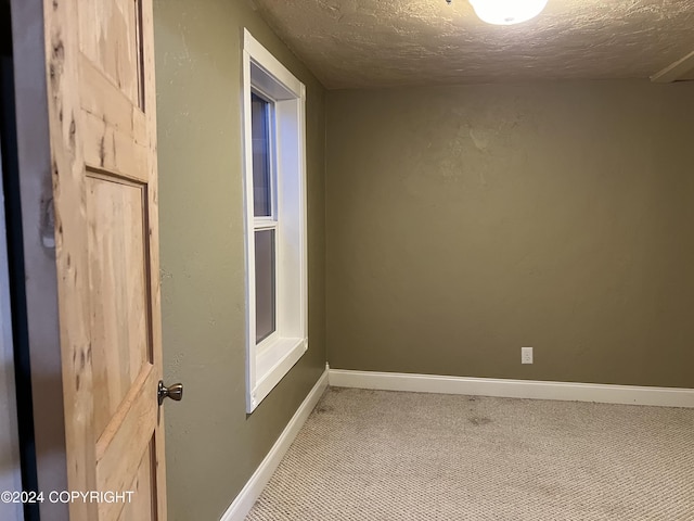 38400 Robinson Loop Rd, Sterling, AK 99672 - carpeted empty room featuring a textured ceiling and baseboards