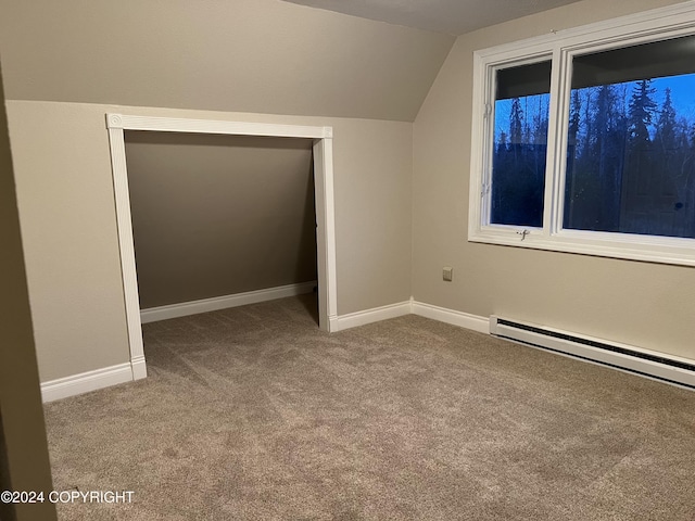 38400 Robinson Loop Rd, Sterling, AK 99672 - bonus room featuring carpet, lofted ceiling, a baseboard radiator, and baseboards
