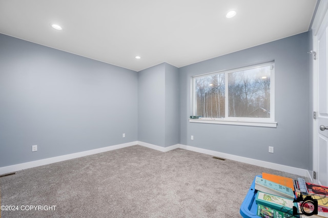 empty room featuring carpet flooring