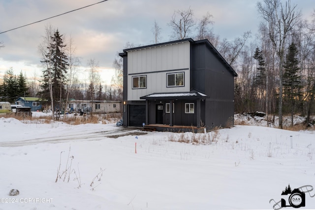 view of snow covered house