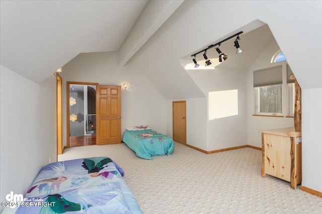 bedroom with lofted ceiling with beams and light colored carpet