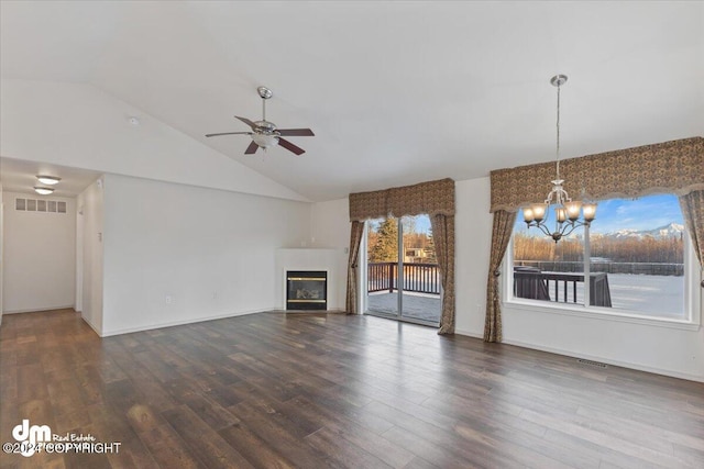 unfurnished living room featuring hardwood / wood-style floors, ceiling fan with notable chandelier, and high vaulted ceiling