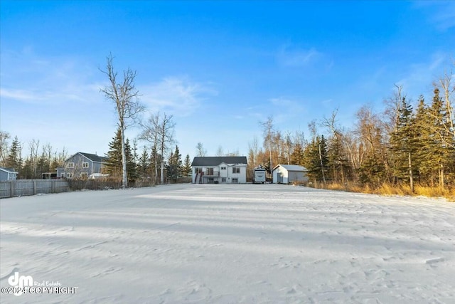 view of yard layered in snow