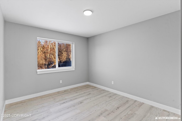 unfurnished room featuring light wood-type flooring