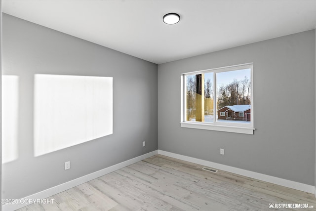 empty room featuring light hardwood / wood-style flooring