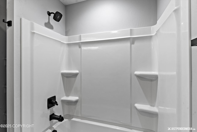 bathroom with shower / bathing tub combination